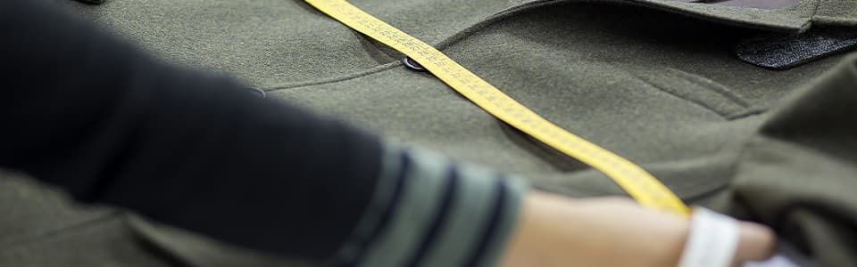 Atelier — measuring a wool coat for the next collection