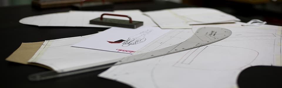 Pattern pieces and sketch on the cutting table